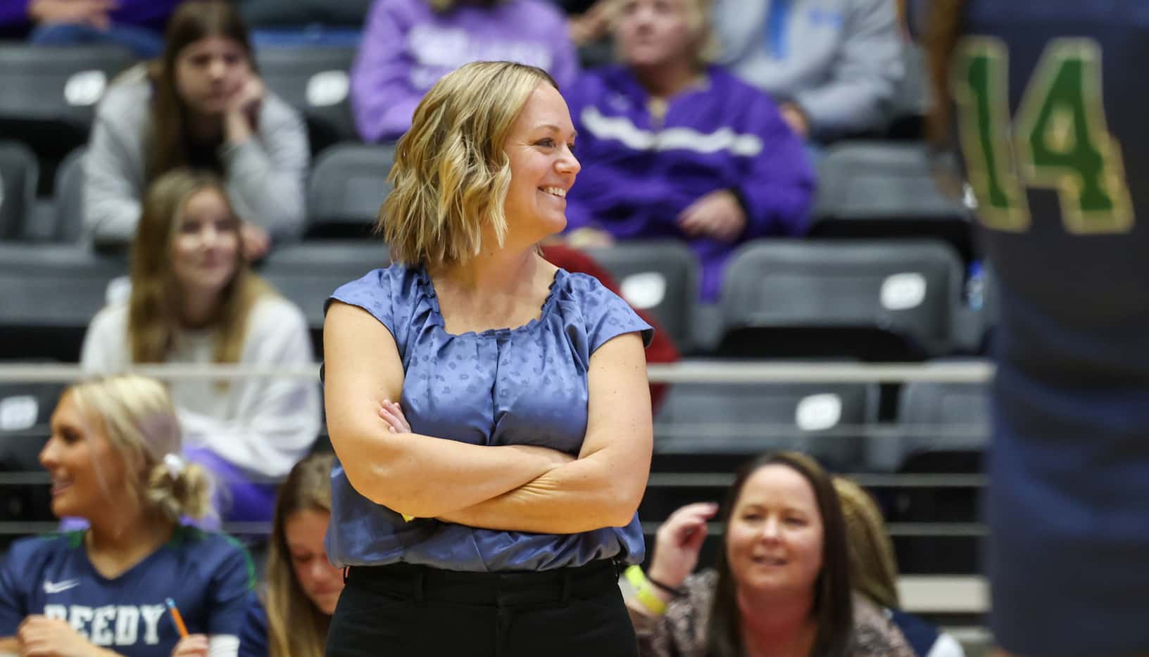 Frisco Reedy coach Katie Rudd smiles after a team point against Liberty Hill as they compete...