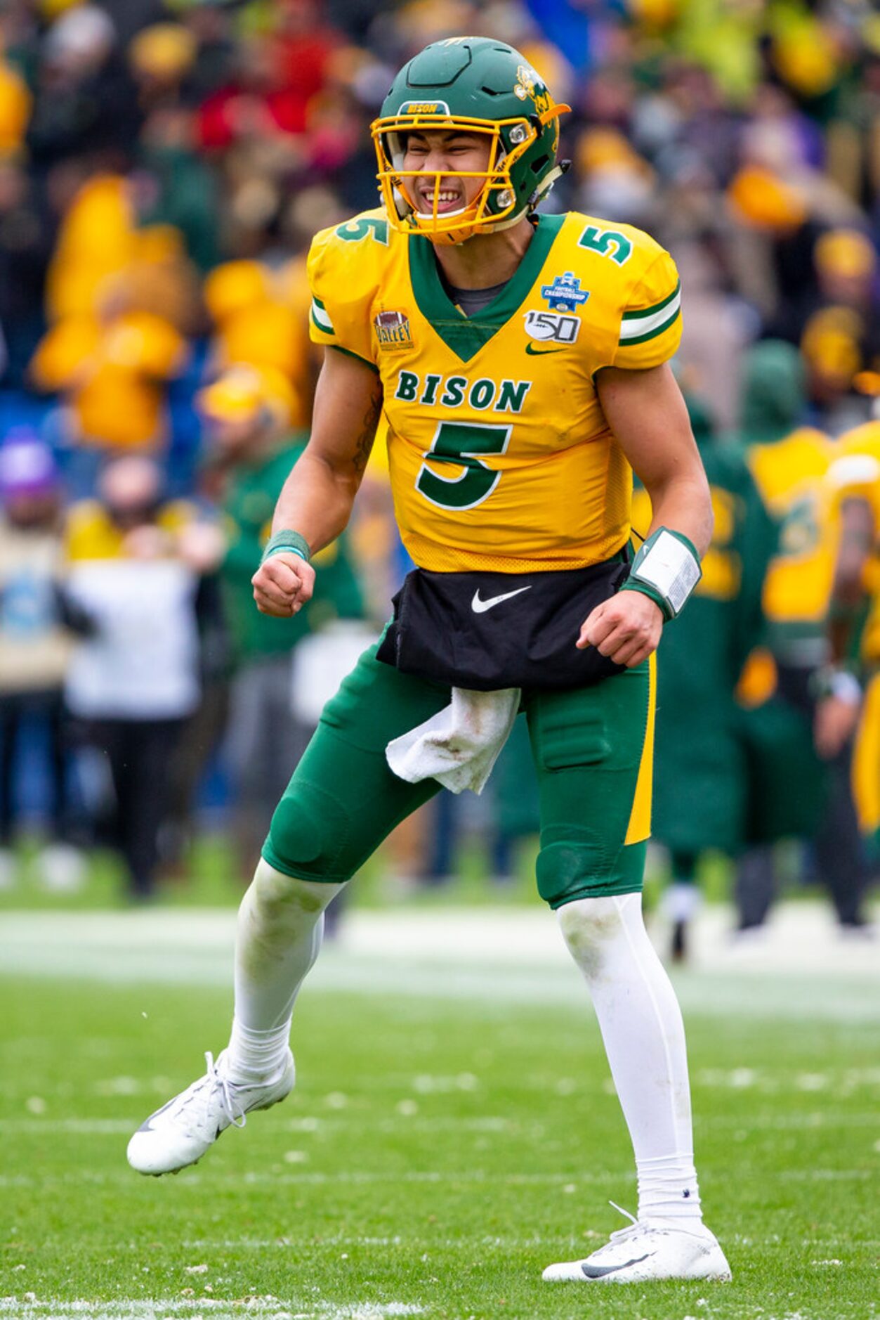 North Dakota State quarterback Trey Lance (5) smiles on the field after his team scored a...