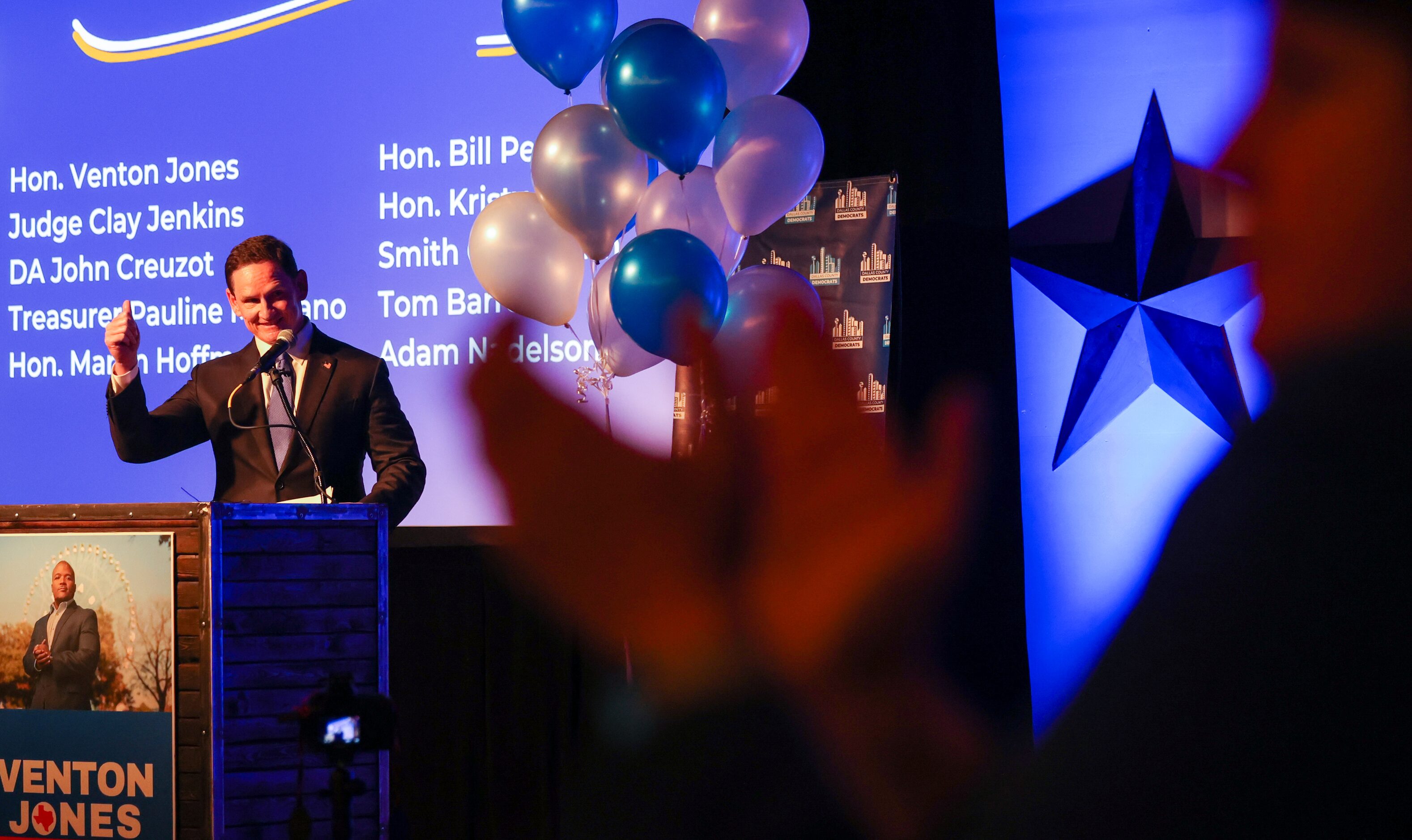 Incumbent Clay Jenkins raises his arm in celebration of sweeping the race for Dallas county...