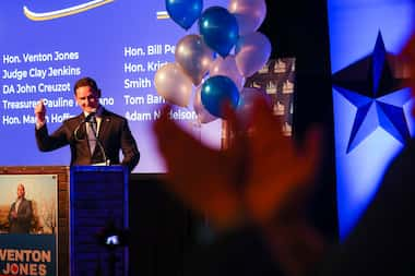 Incumbent Clay Jenkins raises his arm in celebration of sweeping the race for Dallas county...