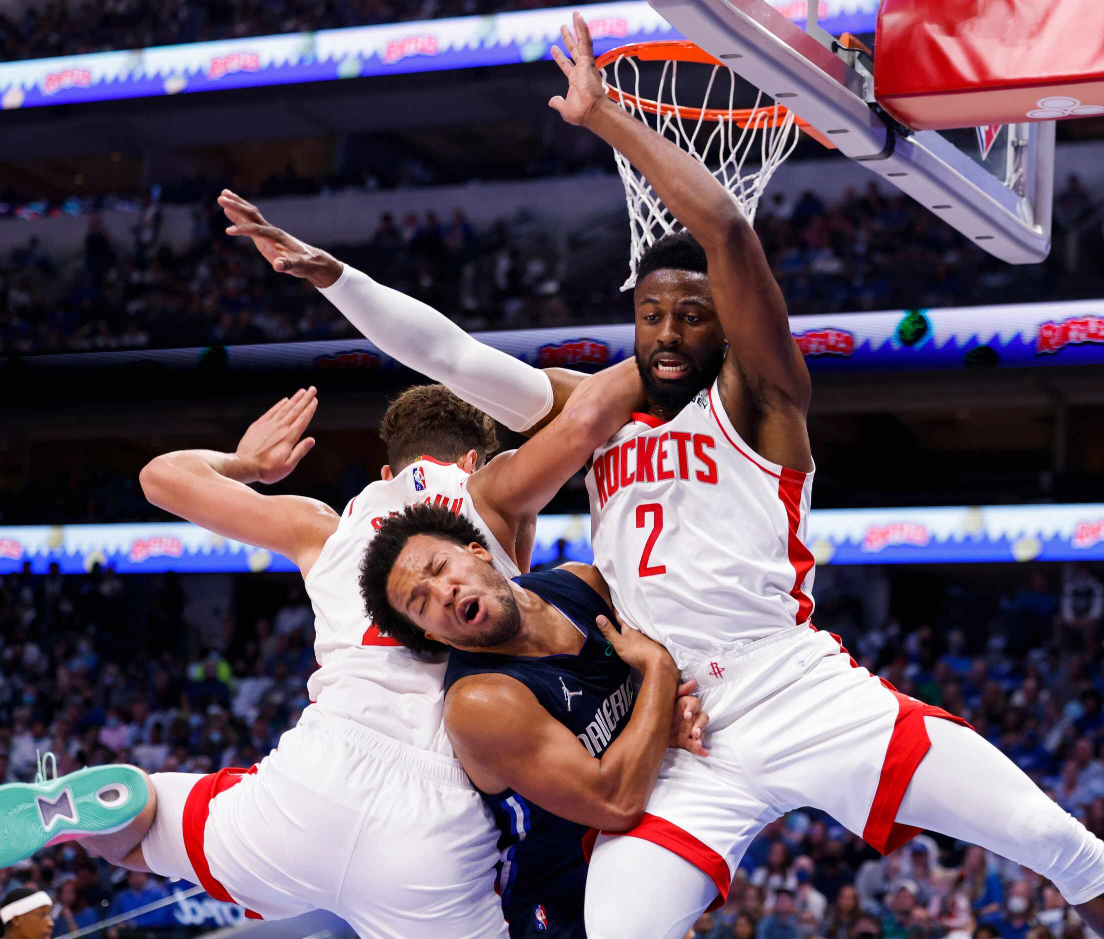 Dallas Mavericks guard Jalen Brunson (13) collides into Houston Rockets forward David Nwaba...