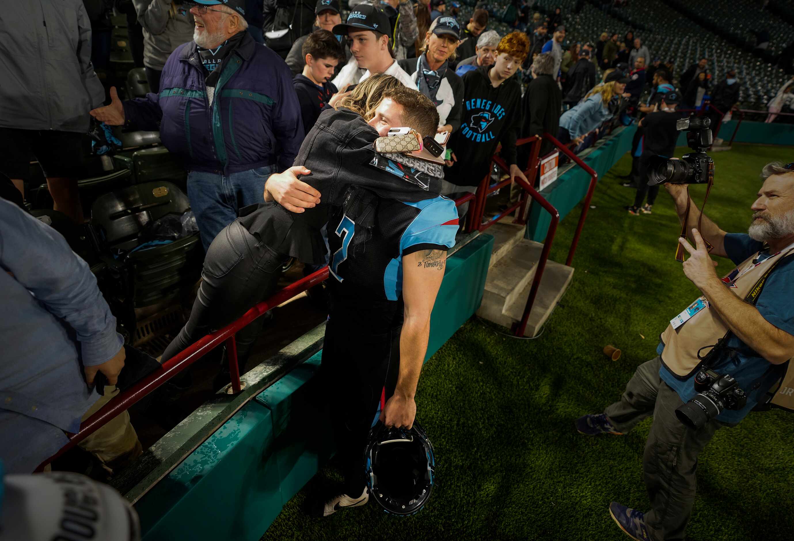 Dallas Renegades punter Drew Galitz gets a hug from his girlfriend after a loss to the St....