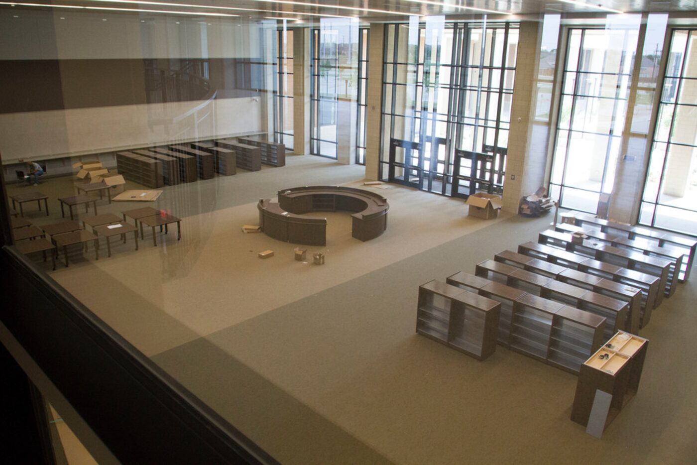 Boxes and bookshelves sit ready for setup during the move in at Frisco ISD's 10th high...