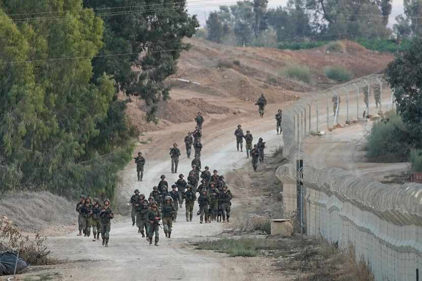 Israeli soldiers patrolling Wednesday, Oct. 11, 2023, near Kibbutz Be'eri, which was overrun...