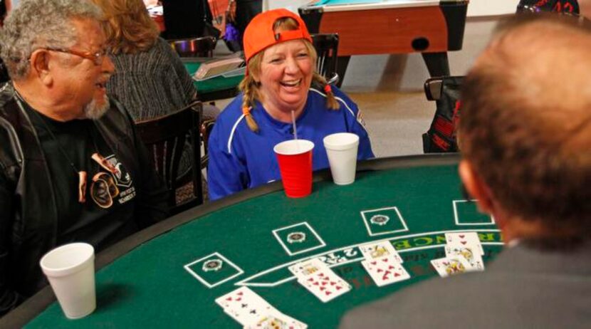 
Reggie Gutierrez (left) and Renay Gingery play blackjack at the VFW Post 4380 casino night....