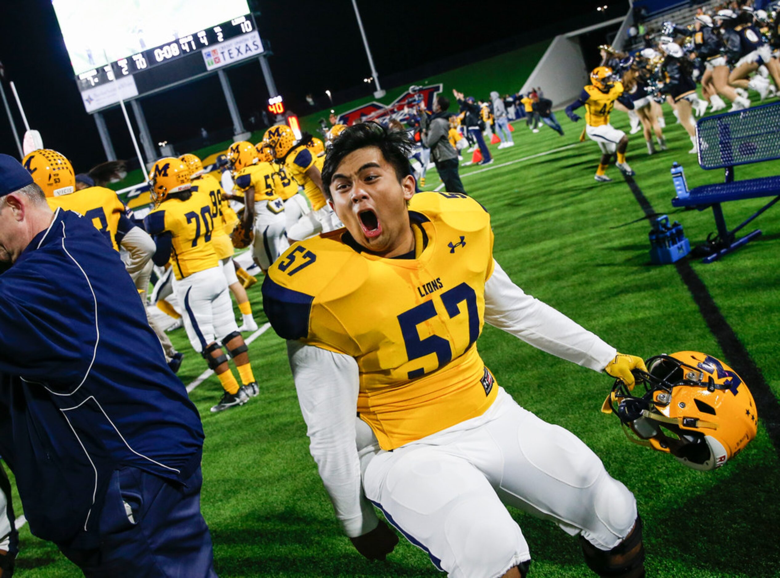 McKinney's Matt Camaligan (57) celebrates in the final moments of their win over McKinney...