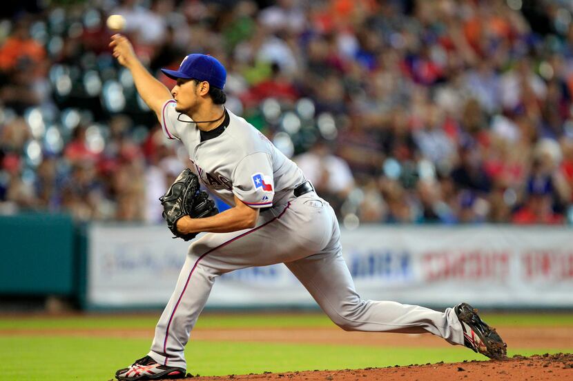 Aug 12, 2013; Houston, TX, USA; Texas Rangers starting pitcher Yu Darvish (11) pitches...