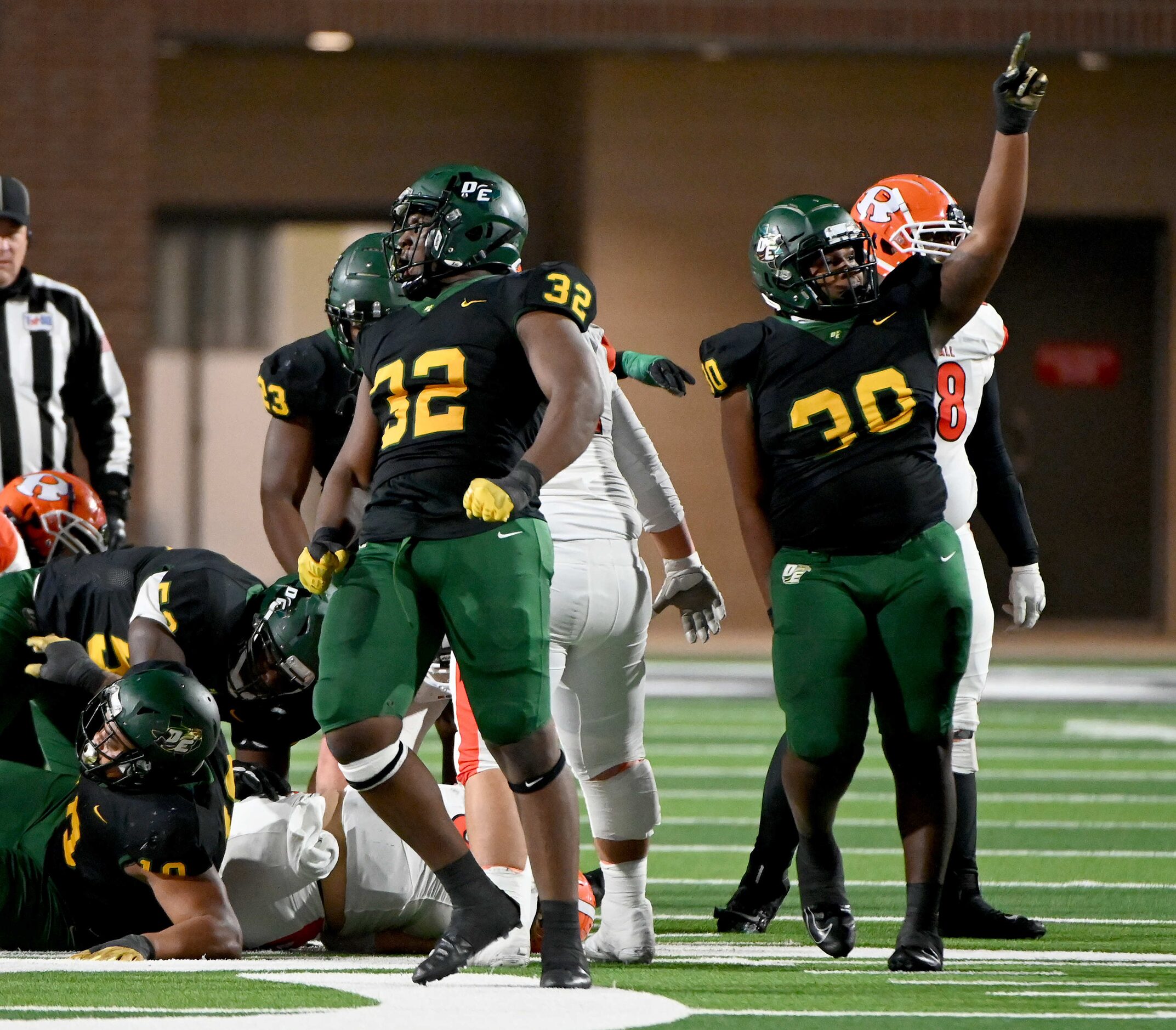 DeSoto’s Shemar Turner (32) and Jaelyn Davis-Robinson celebrate a big defensive stop when...