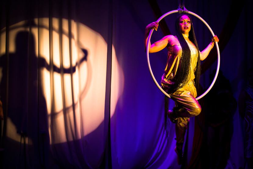 Erykah Badu performs on an aerial hoop, known as the lyra, during the Lone Star Circus 10th...