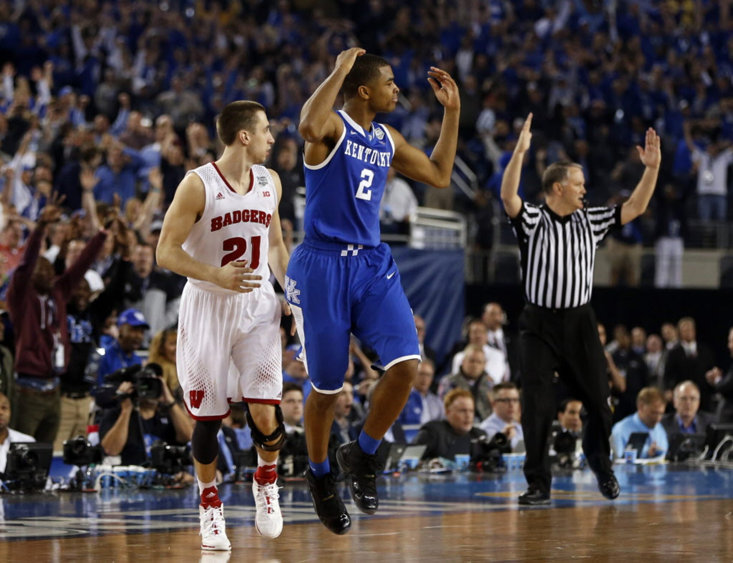 Kentucky Wildcats guard Aaron Harrison (2) celebrates after hitting the go ahead three point...