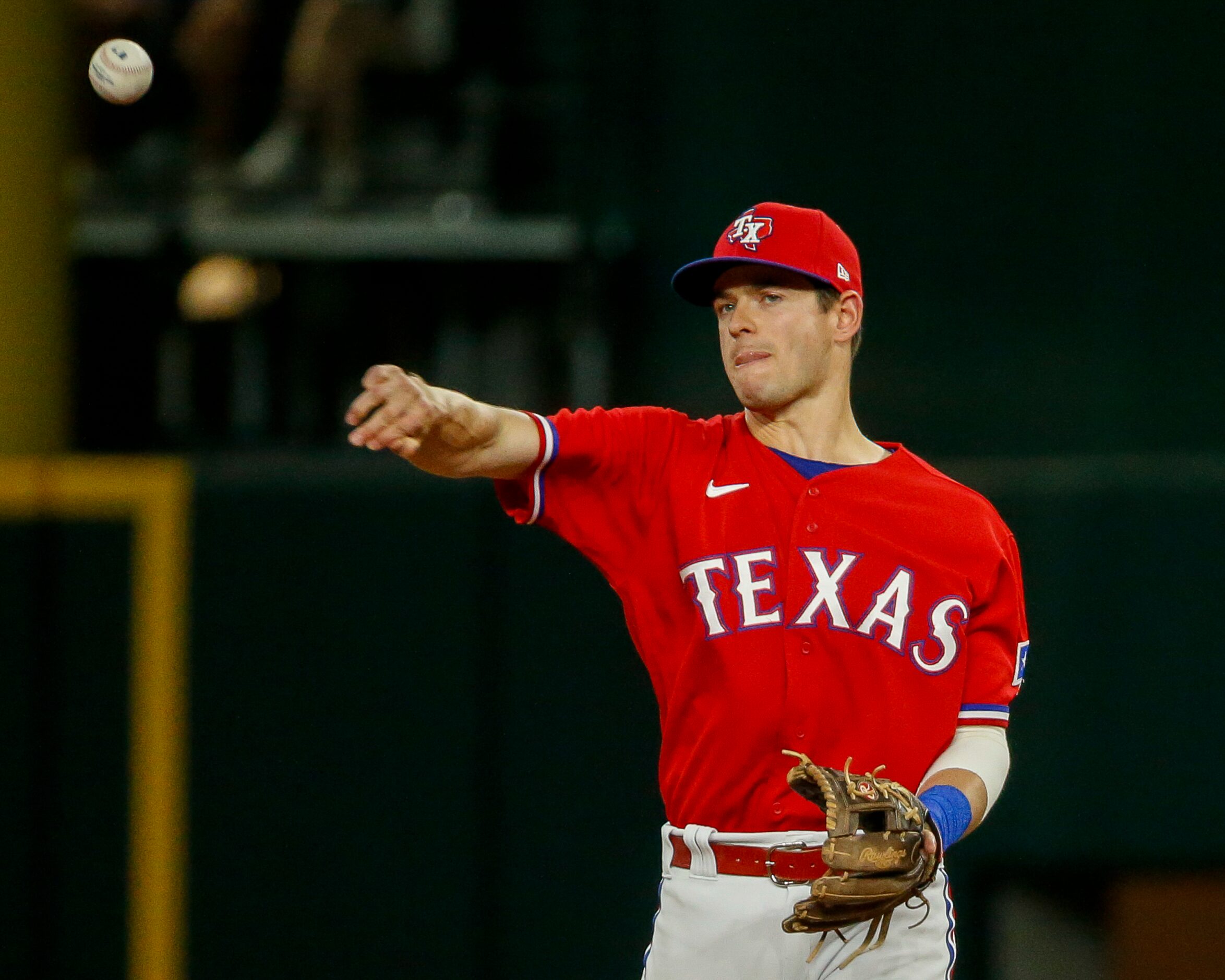 Texas Rangers second baseman Nick Solak (15) throws the ball around the bases during the...