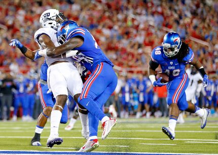 Southern Methodist Mustangs defensive back Darrion Millines (29) makes helmet to helmet...