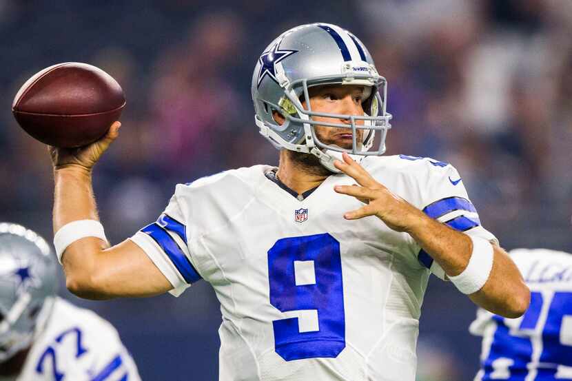 Dallas Cowboys quarterback Tony Romo (9) throws a pass during the first quarter of their...