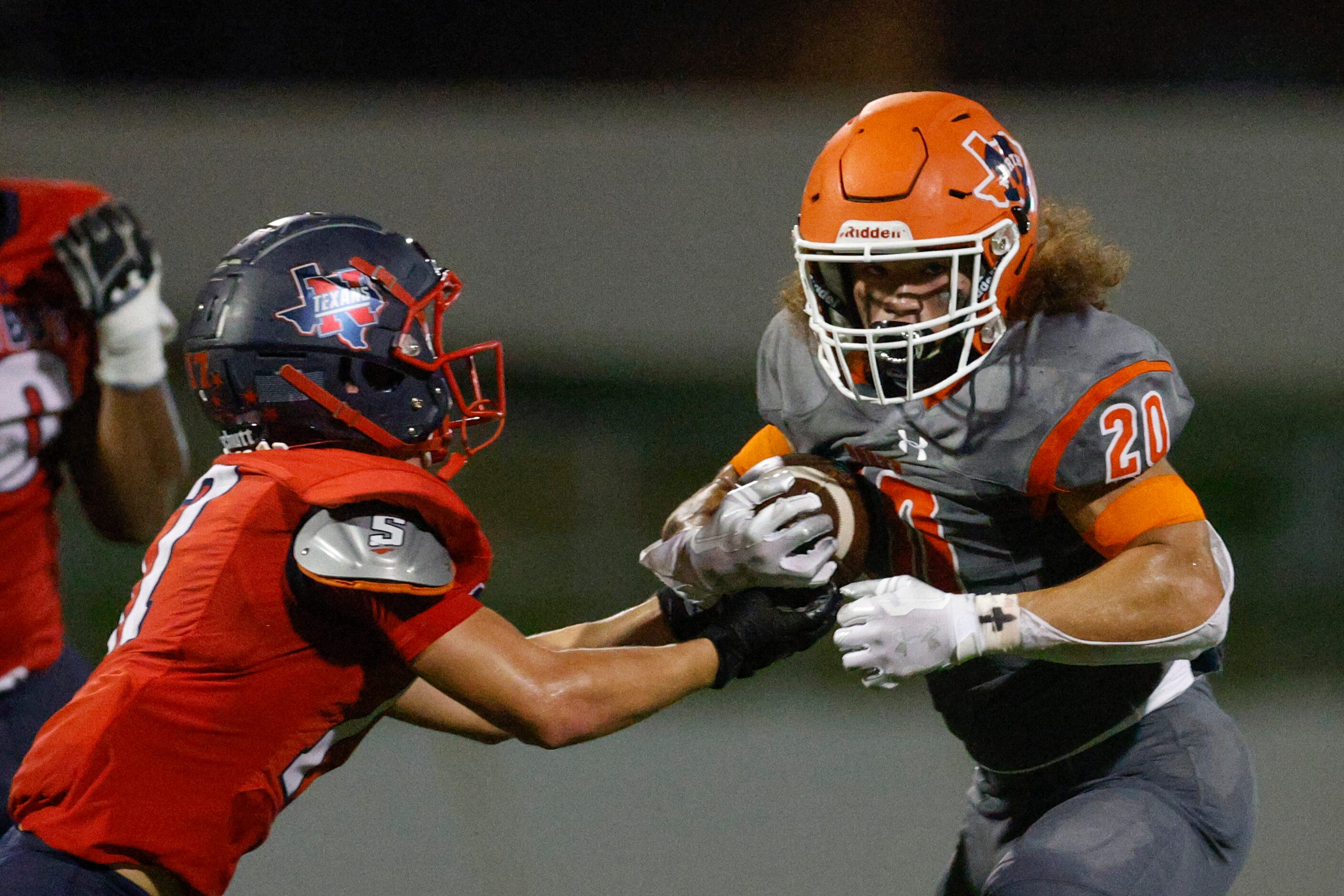 Justin Northwest defensive back Casen Foster (17) tackles McKinney North running back...