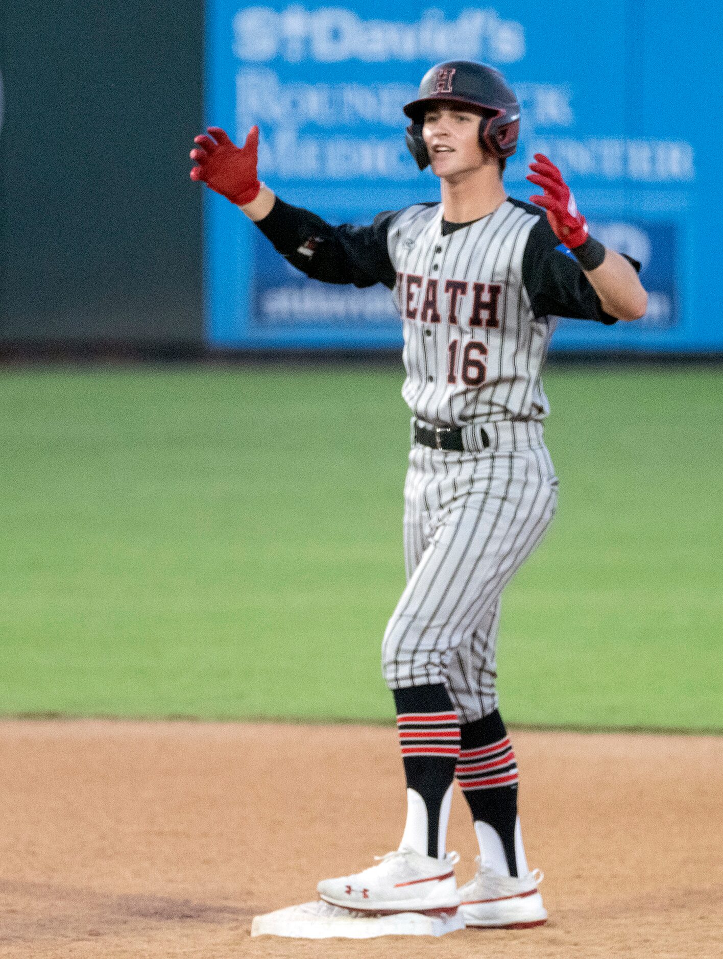 Rockwell-Heath Caden Fiveash, (16), celebrates his double against  Comal Smithson Valley...