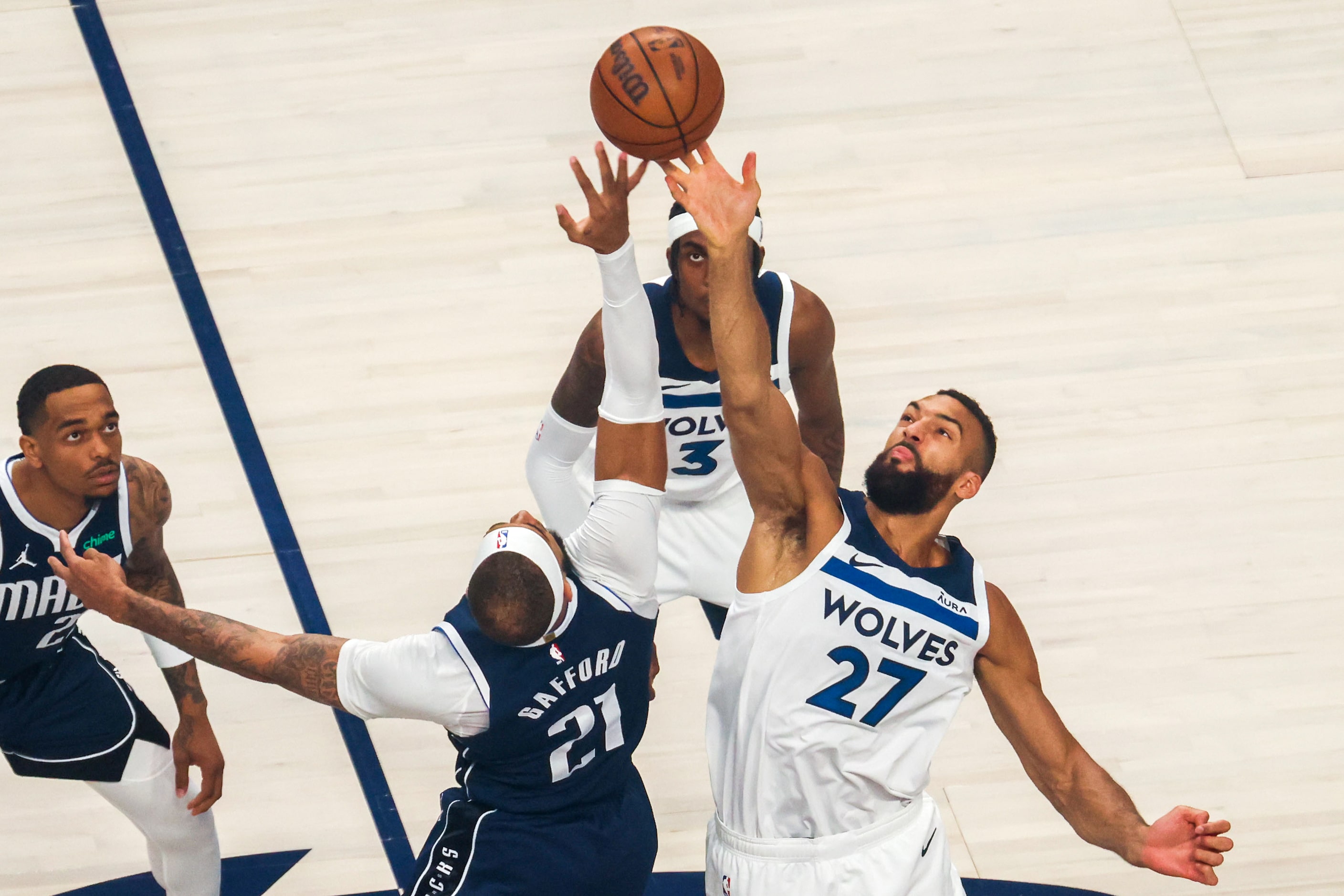 Dallas Mavericks center Daniel Gafford (21) and Minnesota Timberwolves center Rudy Gobert go...