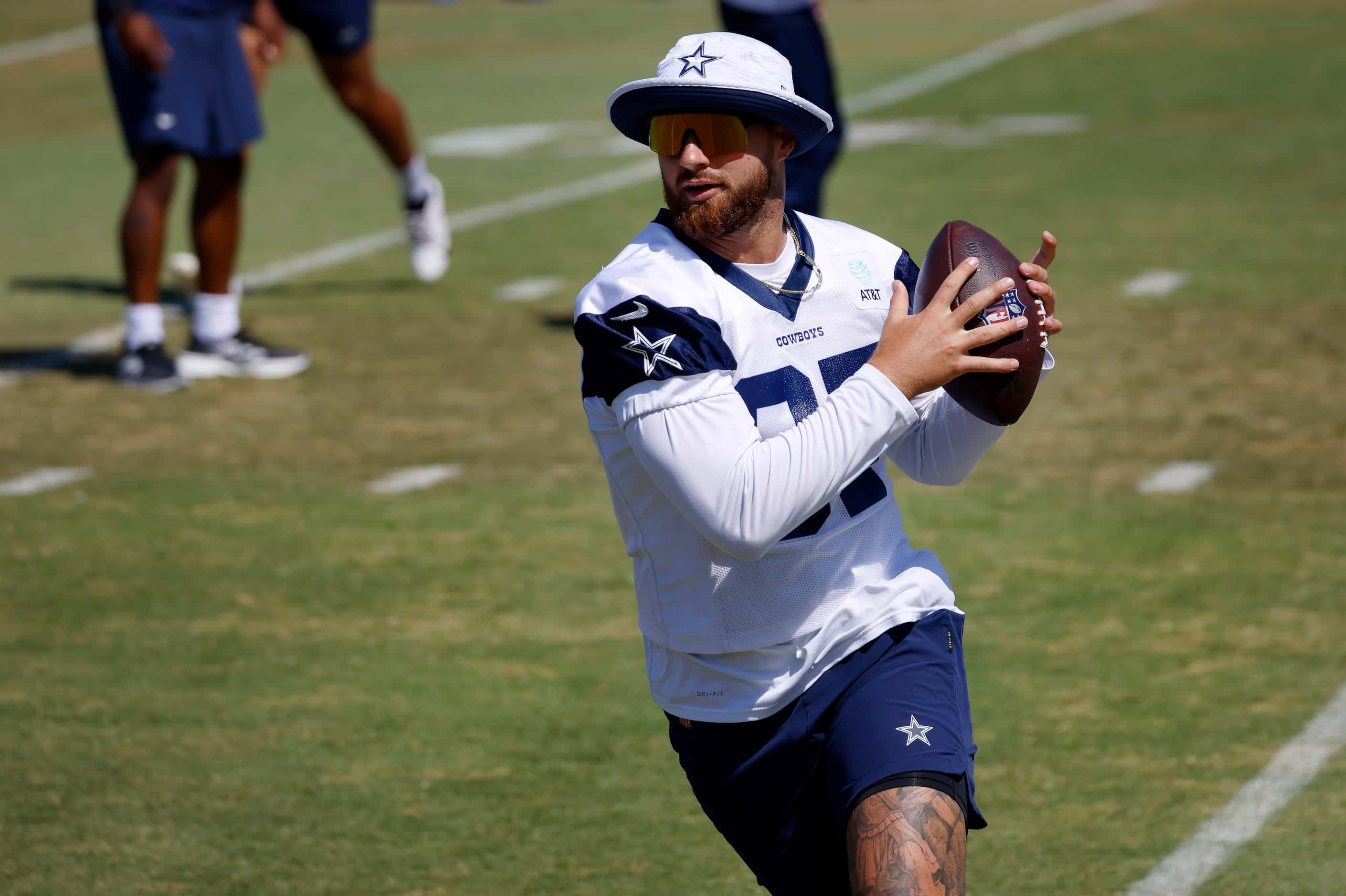 Dallas Cowboys tight end Jake Ferguson (87) catches a pass during a mock game workout in...