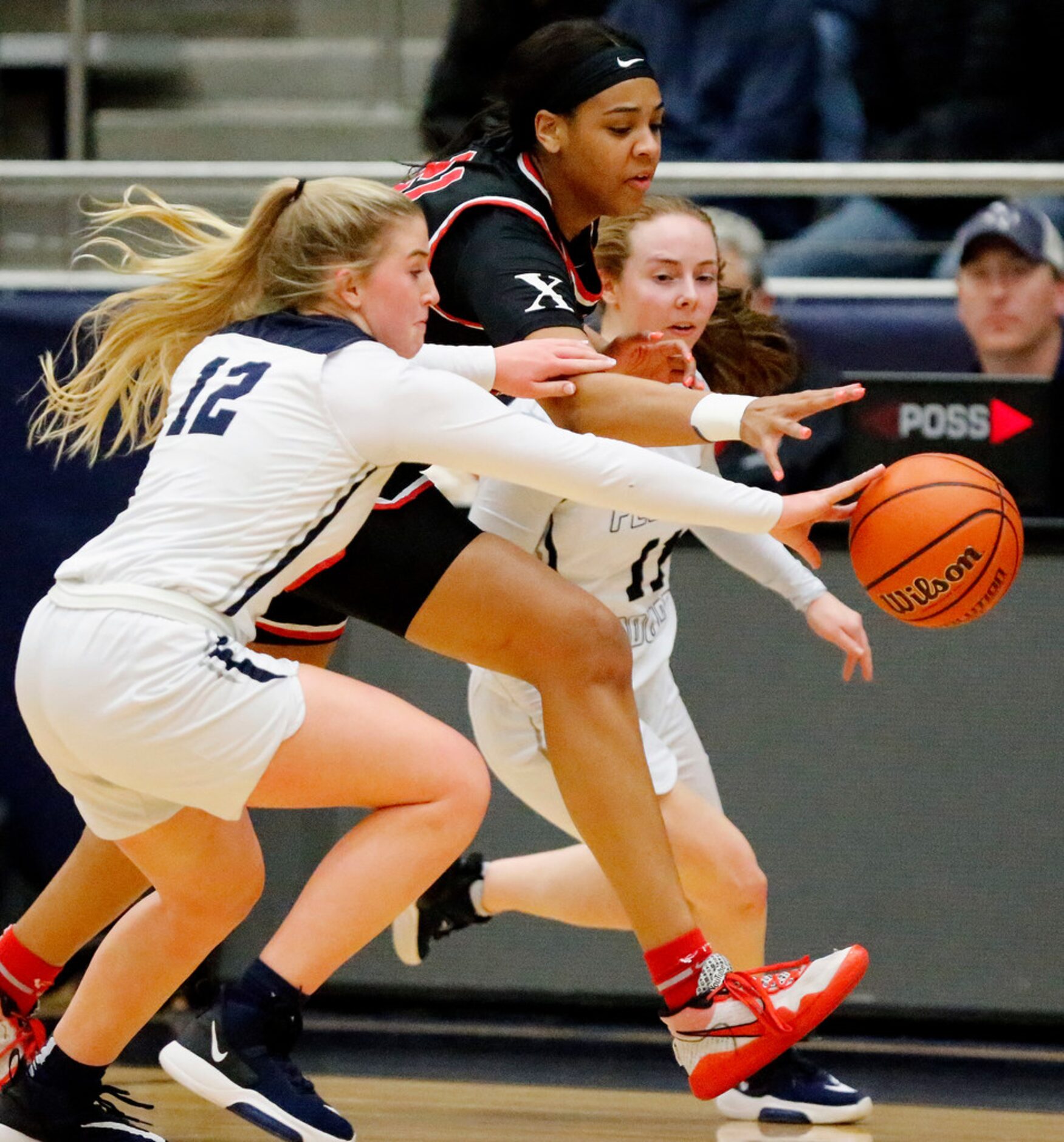 Flower Mound High School guard Kayla Wallace (12) and Flower Mound High School guard...