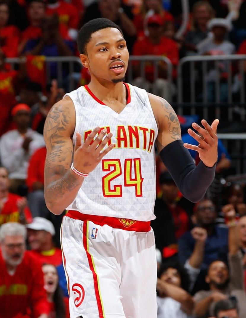 ATLANTA, GA - MAY 06:  Kent Bazemore #24 of the Atlanta Hawks reacts after hitting a...