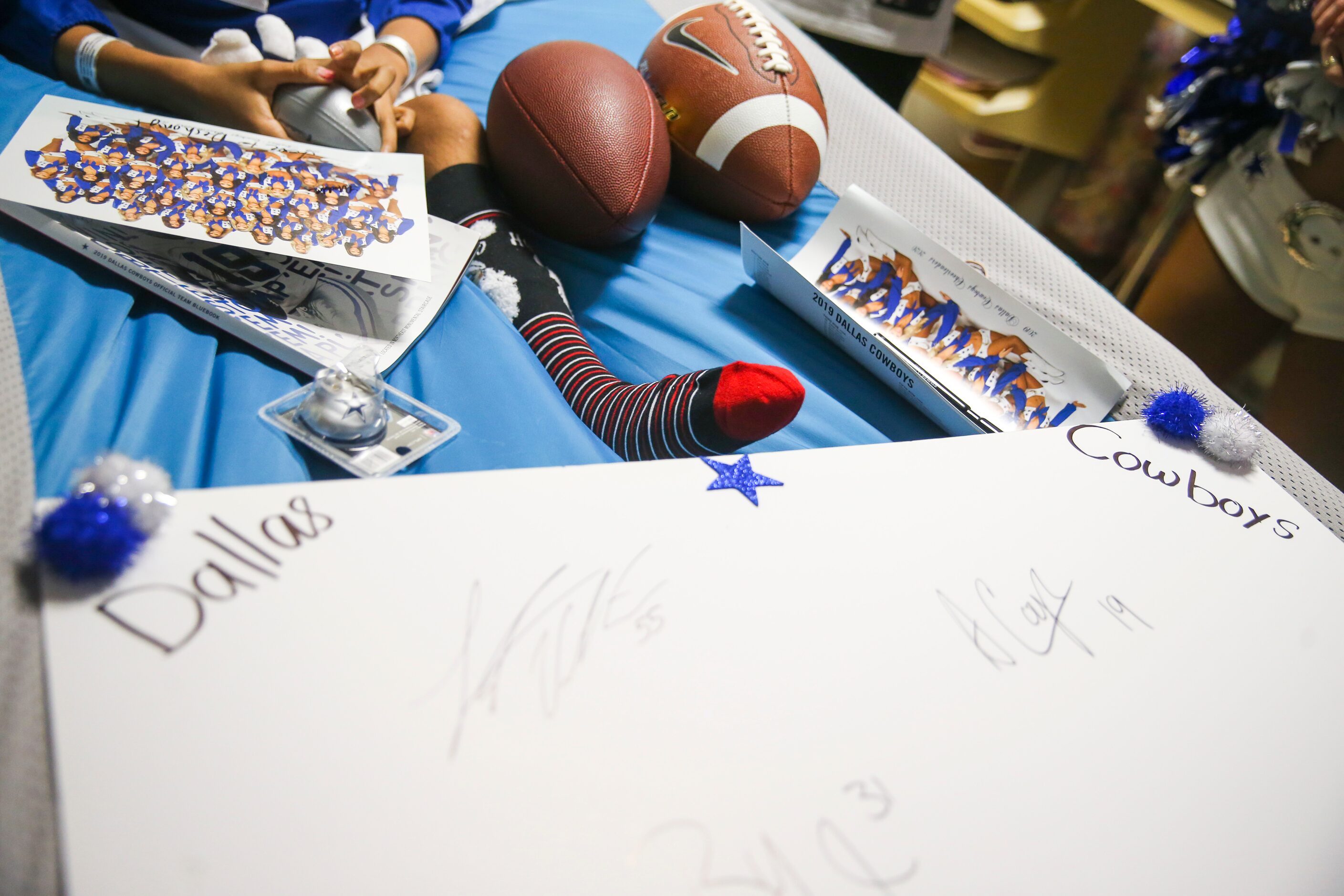 Dallas Cowboys memorabilia sit on Deshony âShonyâ Carawayâs, 12, bed during the...