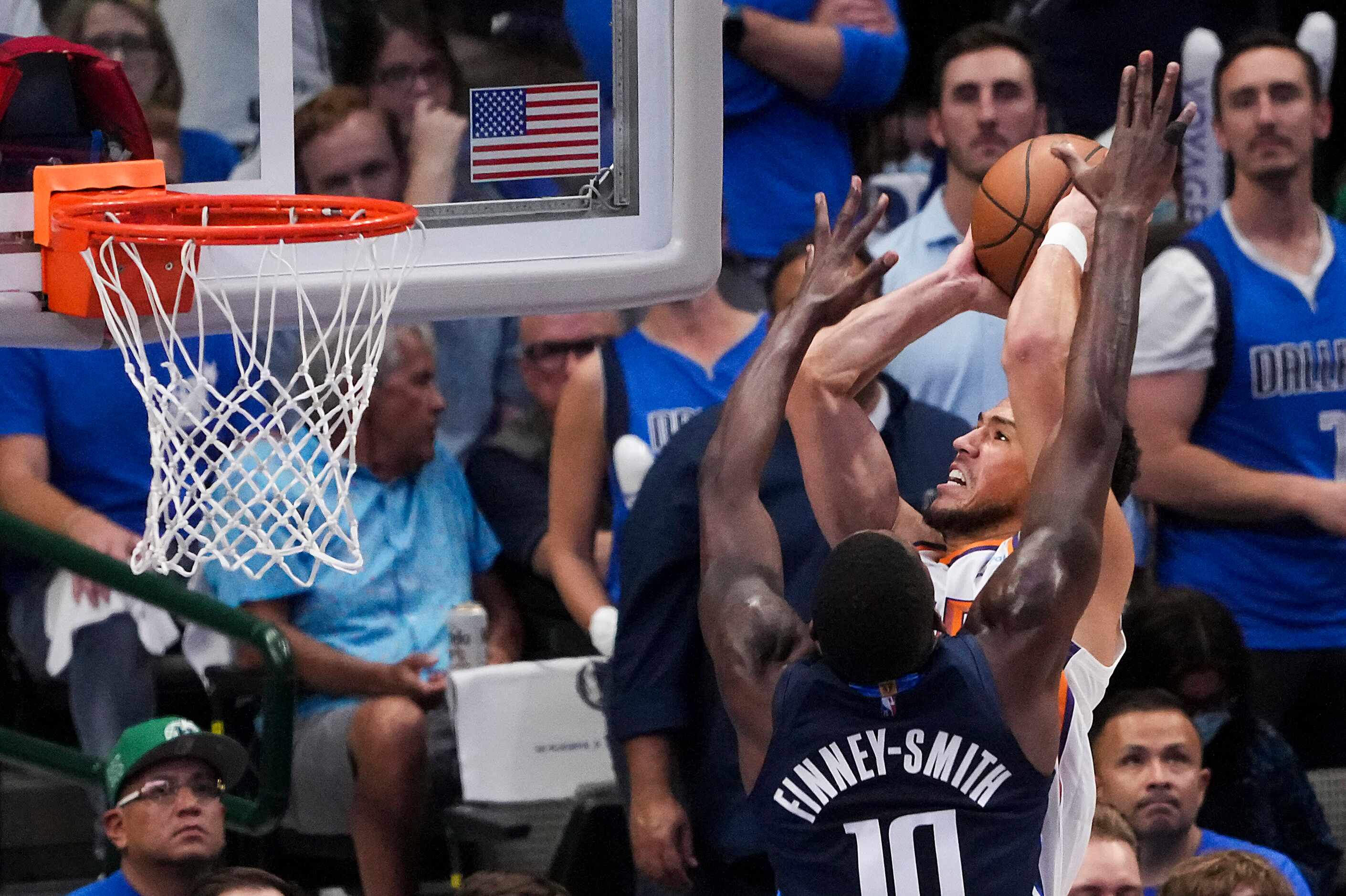 Phoenix Suns guard Devin Booker (1) shoots over Dallas Mavericks forward Dorian Finney-Smith...