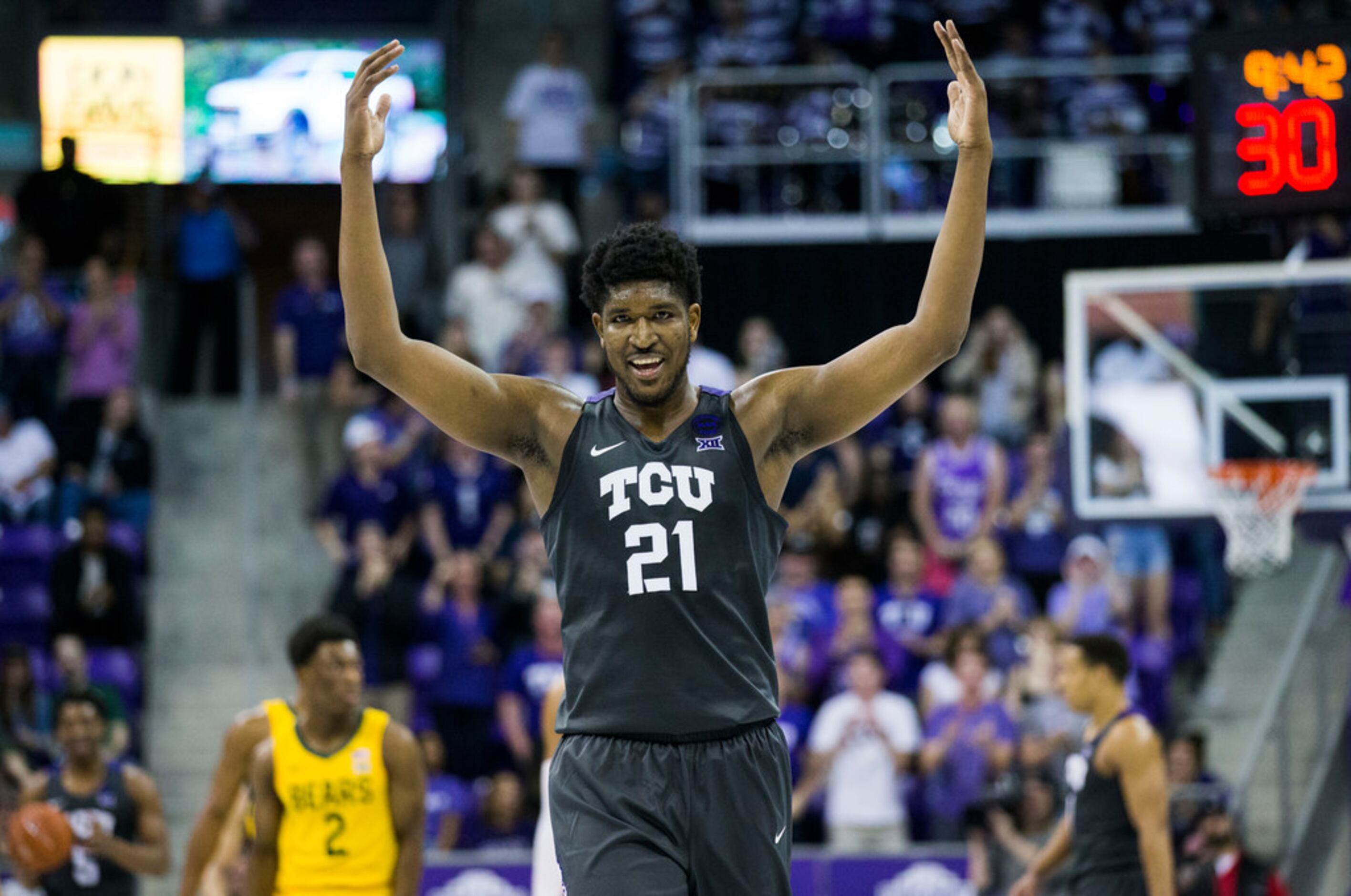 TCU Horned Frogs center Kevin Samuel (21) tries to pump up fans during the second half of an...