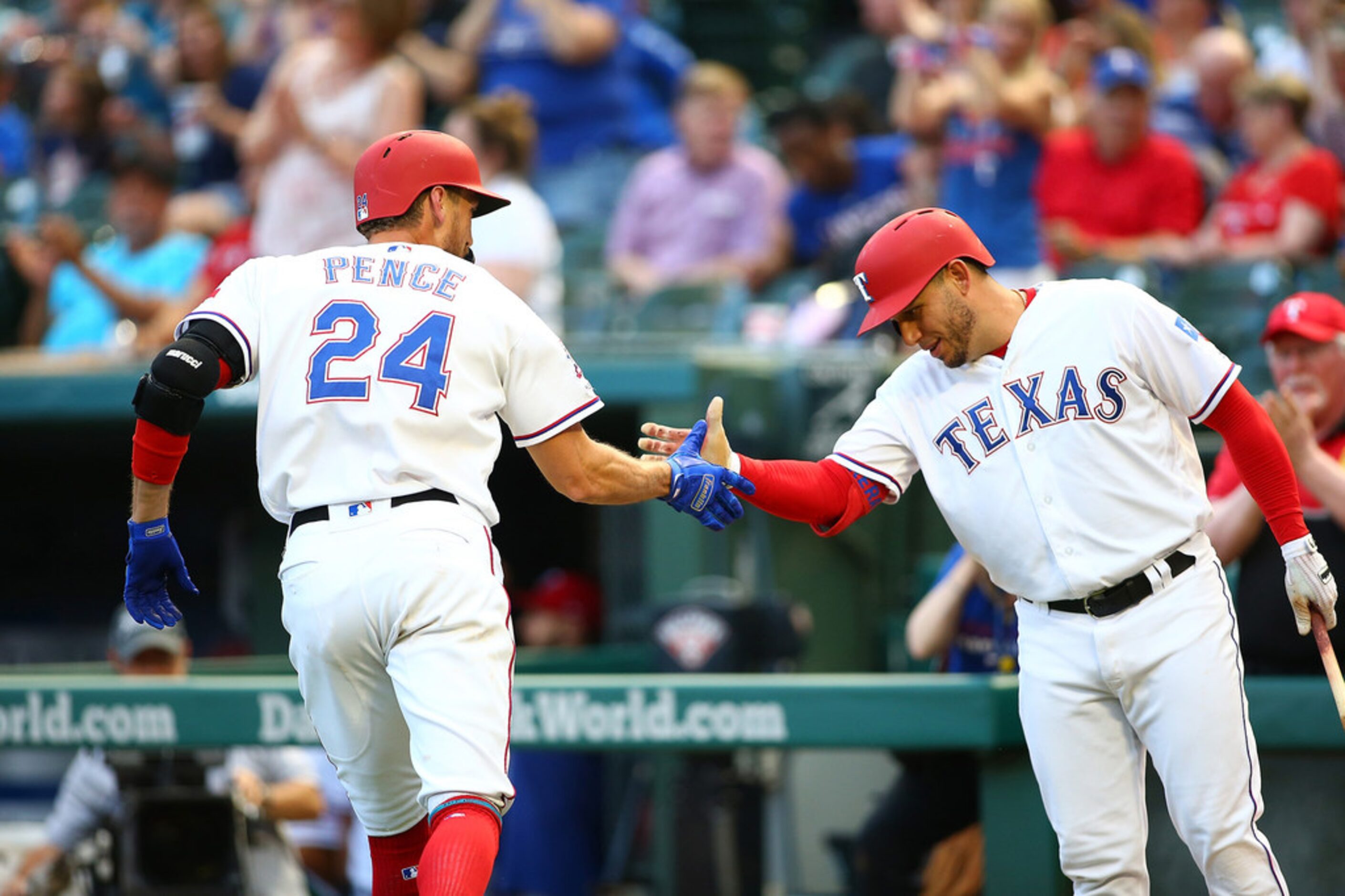 Asdrubal Cabrera, right, of the Texas Rangers congratulates teammate Hunter Pence for...