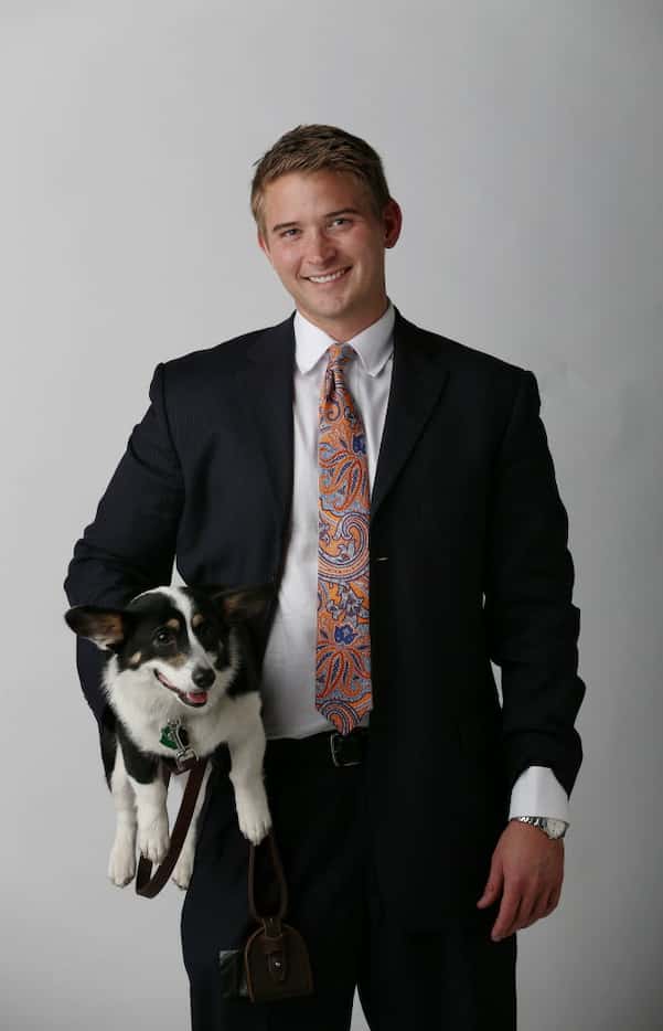 Criminal defense attorney Bryan Wilson stands for a portrait with his dog, Muffins