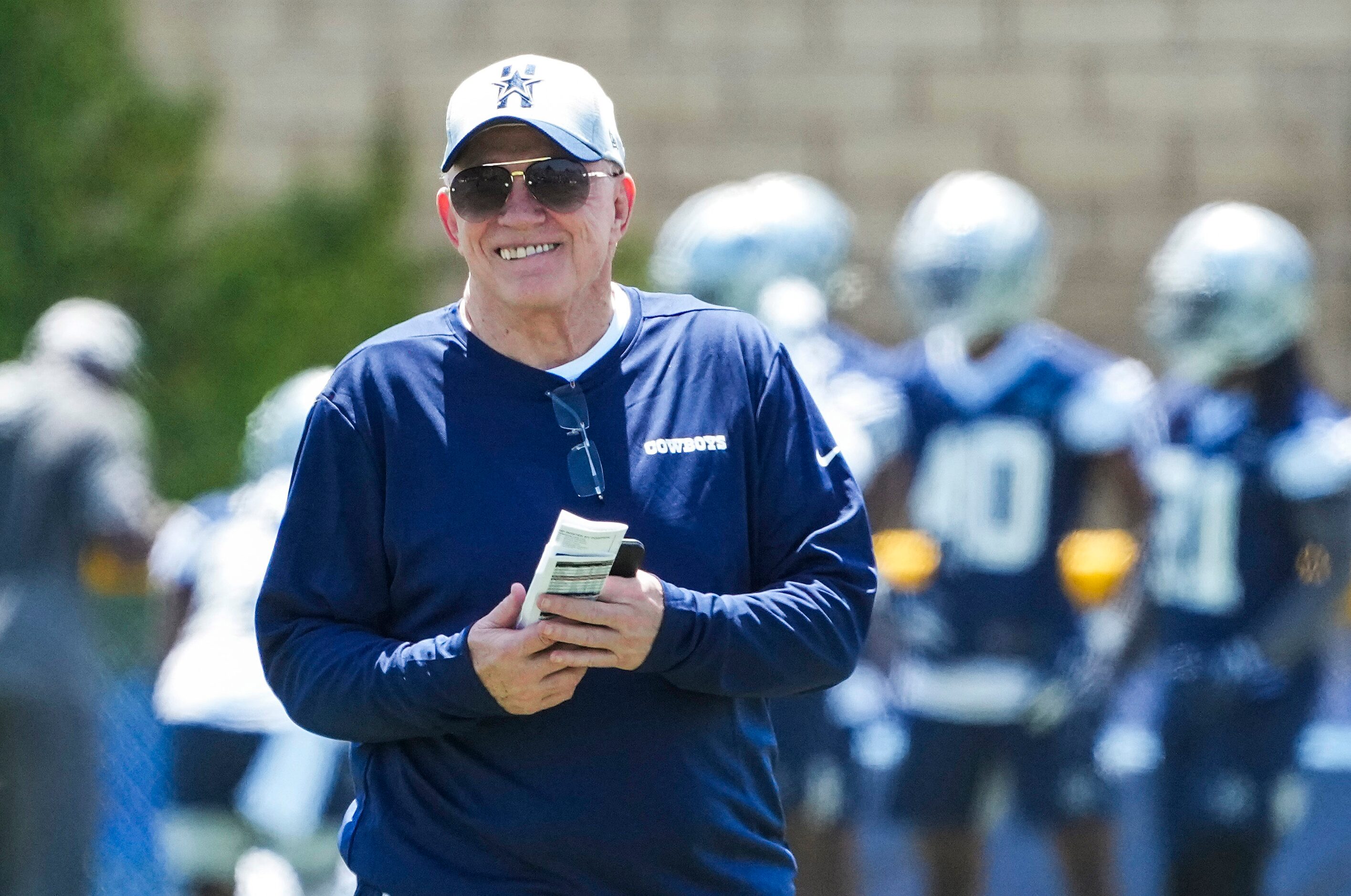 Dallas Cowboys owner and general manager Jerry Jones watches the first practice of the...