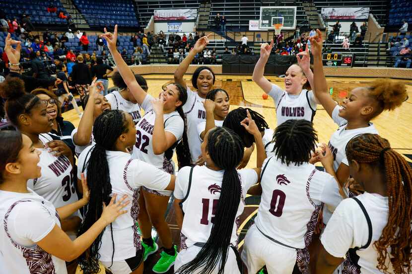 Mansfield Timberview players celebrate after winning the Mansfield Spring Creek Barbeque...