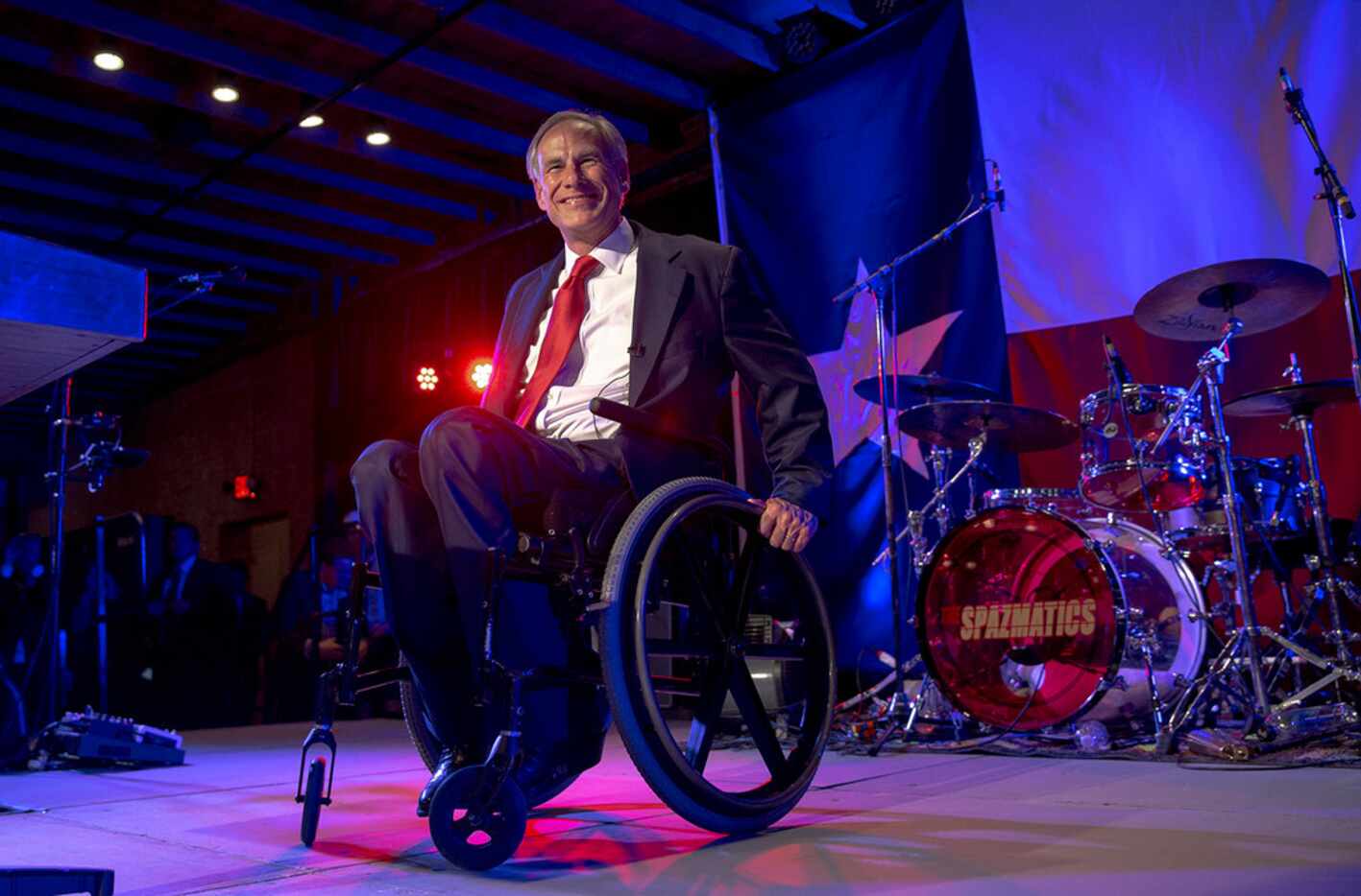 Texas Gov. Greg Abbott appears in front of a crowd of supporters during the Texas GOP...