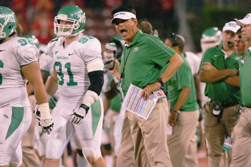 University of North Texas offensive coordinator Mike Canales lets out his frustration after...