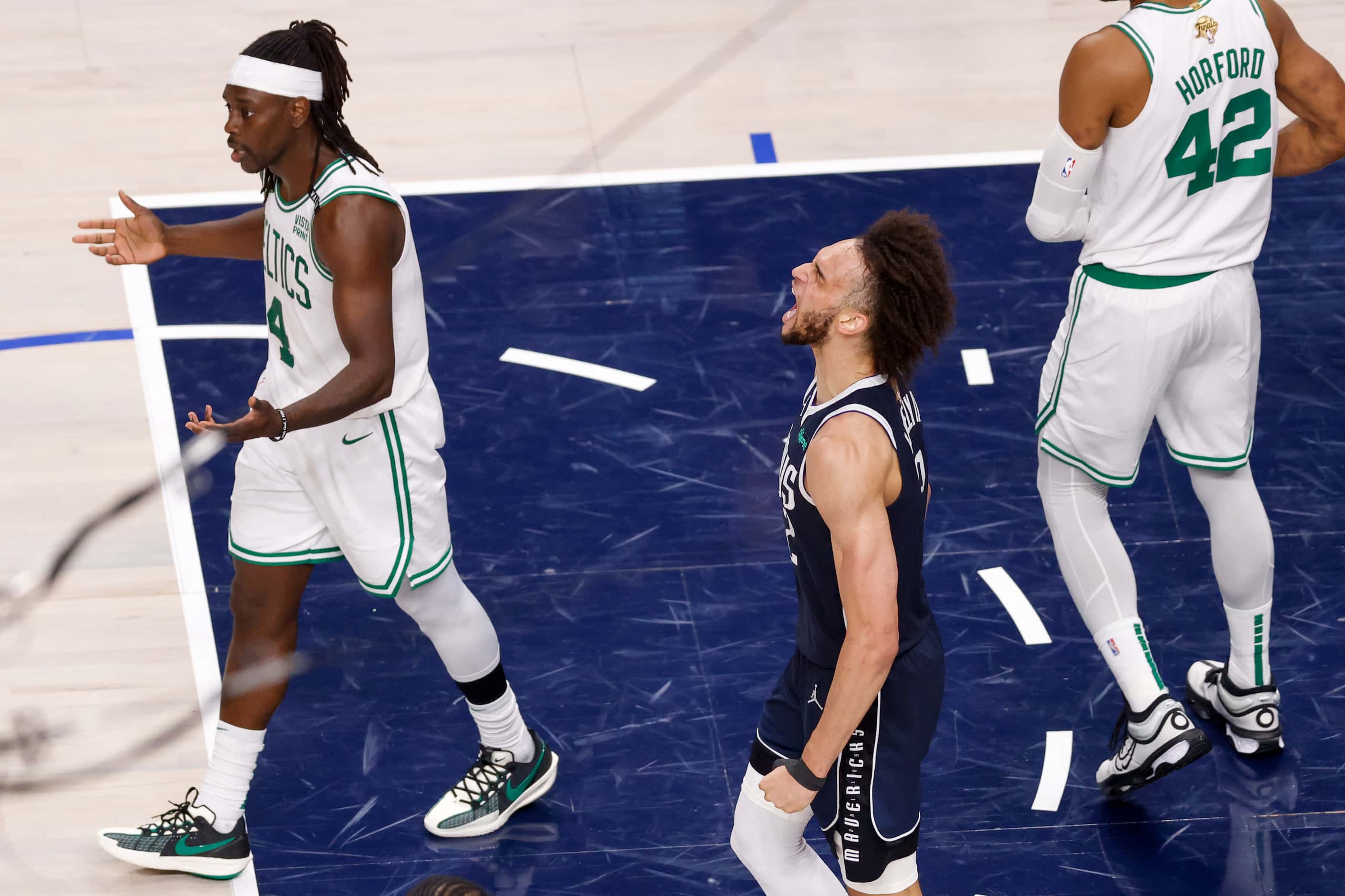 Dallas Mavericks center Dereck Lively II (2) reacts after a dunk alongside Boston Celtics...