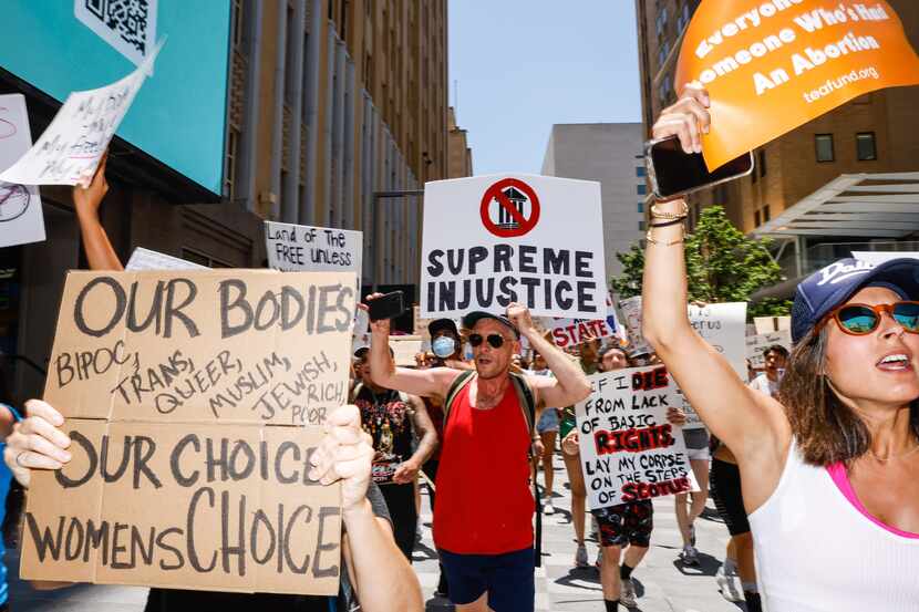 Abortion rights supporters and opponents clash while demonstrating in downtown Dallas on...