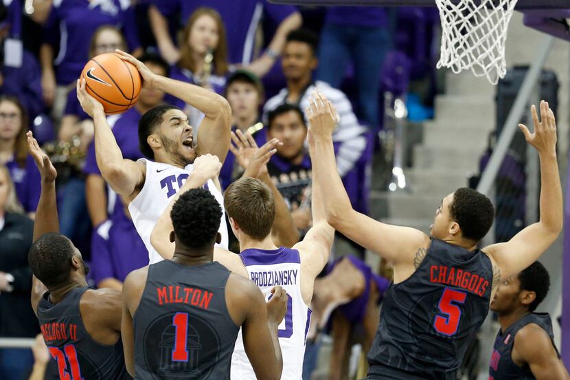 TCU Horned Frogs guard Kenrich Williams (34) grabs a rebound in front of TCU Horned Frogs...