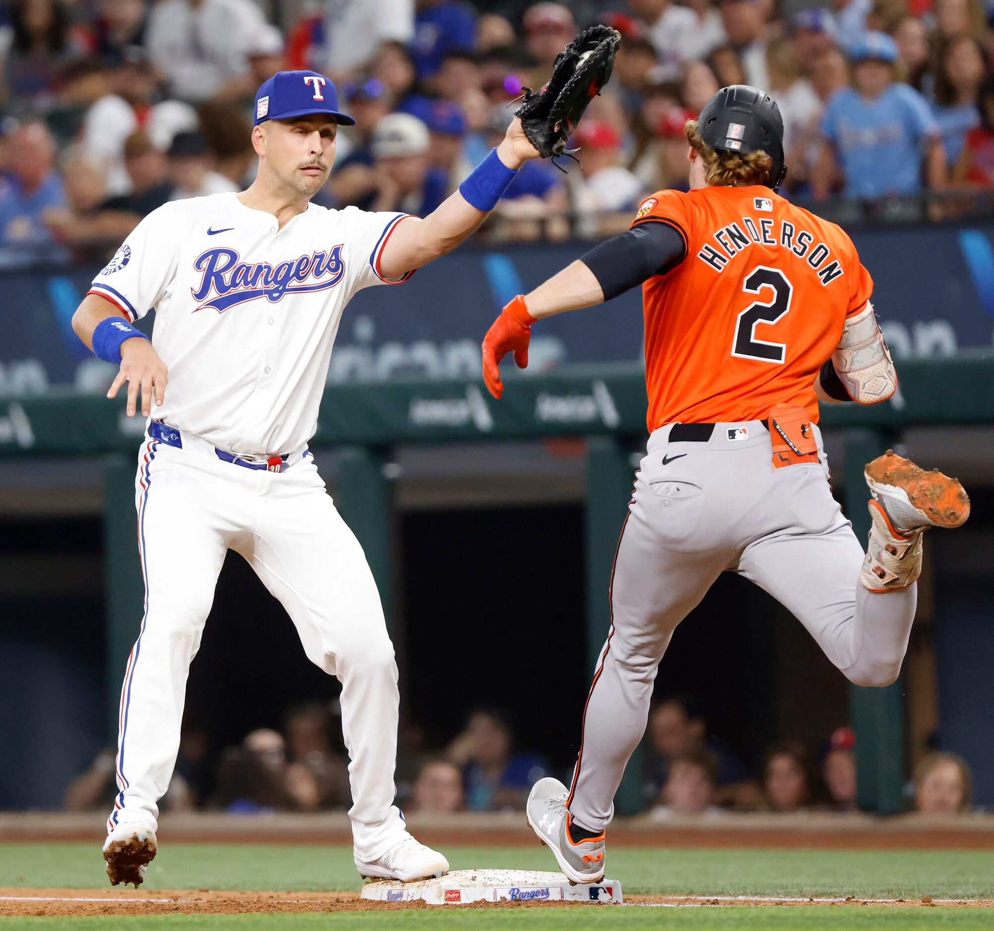 Baltimore Orioles batter Gunnar Henderson (2) is out at at first after starting pitcher Max...