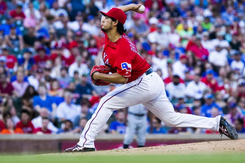 Texas Rangers starting pitcher Yu Darvish (11) pitches during the third inning of their game...