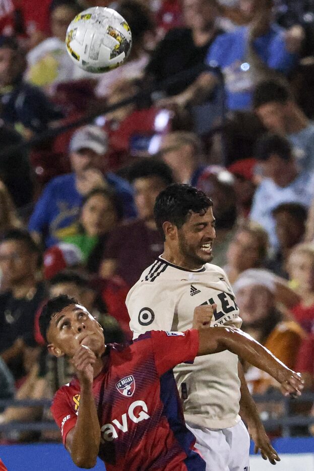 FC Dallas midfielder Edwin Cerrillo (6) and Los Angeles FC forward Carlos Vela (10) jump to...