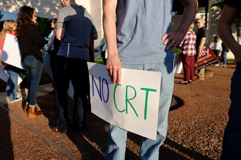 Michael Woodmansee brought a 'No CRT' sign to show concern about critical race theory being...