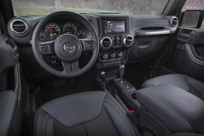 
The interior of the Jeep Wrangler feels a little cramped, with power window and electric...