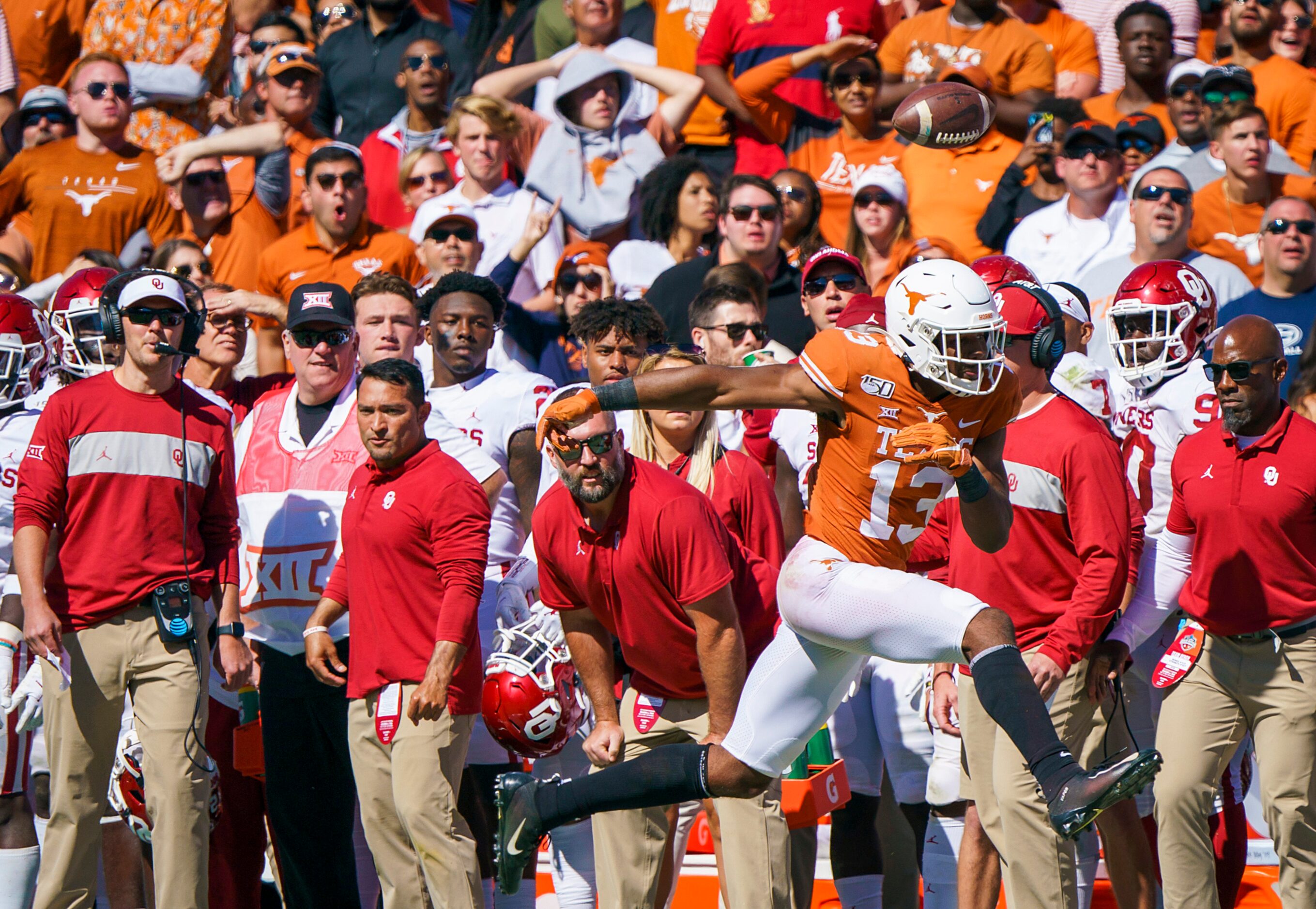 Texas wide receiver Brennan Eagles (13) canÕt keep an onside kick from going into the...