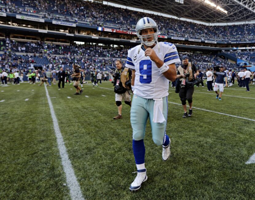 Dallas Cowboys quarterback Tony Romo walks off the field following a 27-7 loss to the...