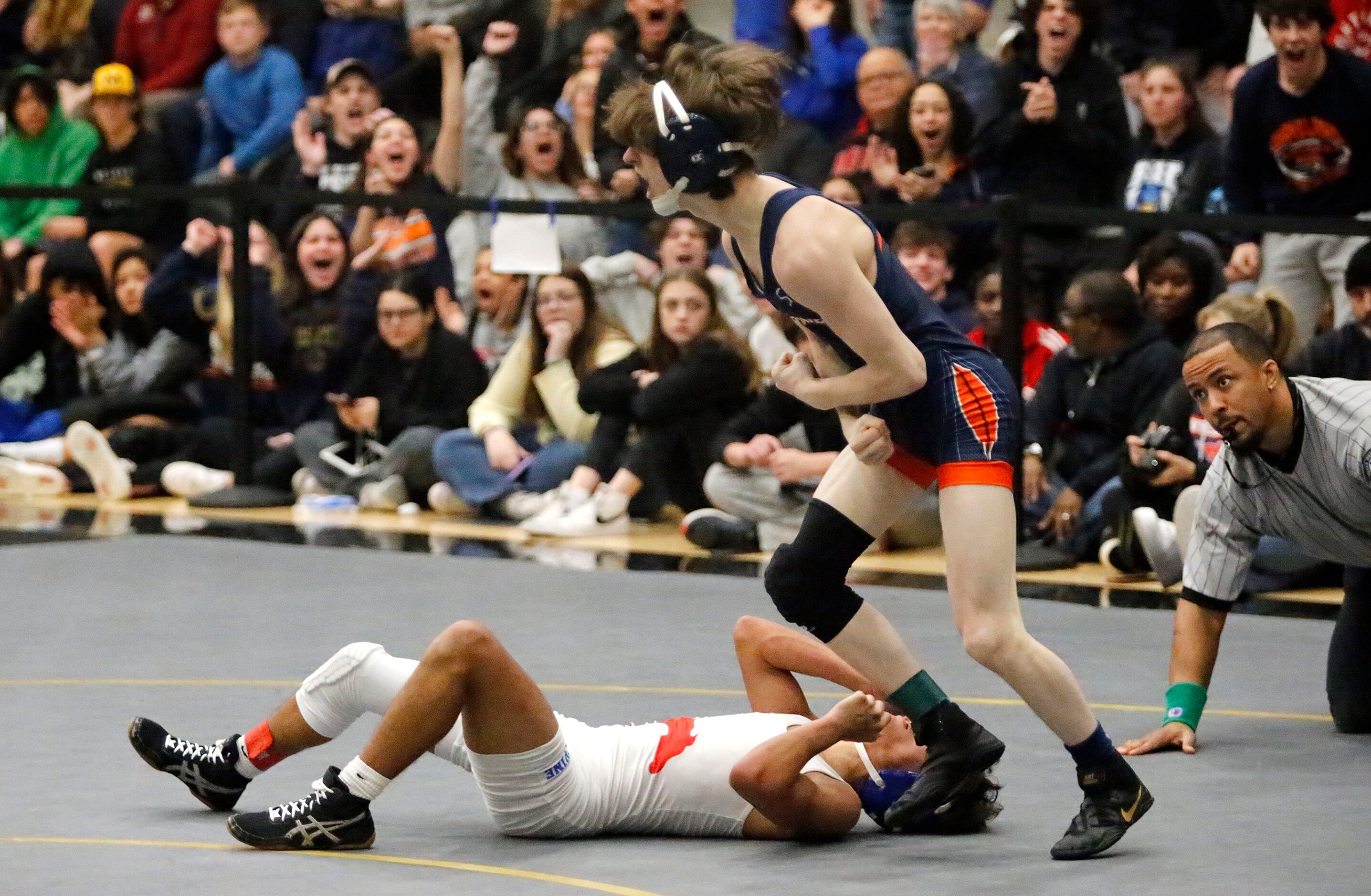 Zach Miller (right) of Wakeland High School, celebrates as he defeats Kevin Contreras of...