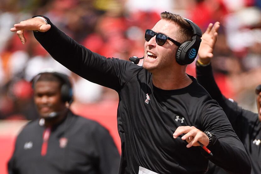 Texas Tech head coach Kliff Kingsbury yells from the sideline during the first half of an...