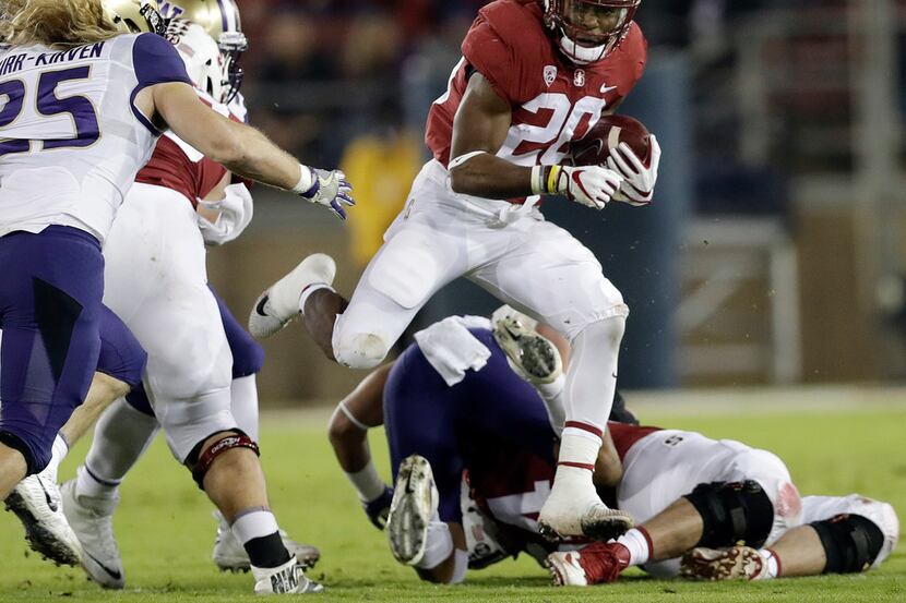 FILE - In this Nov. 10, 2017, file photo, Stanford 's Bryce Love (20) runs against...
