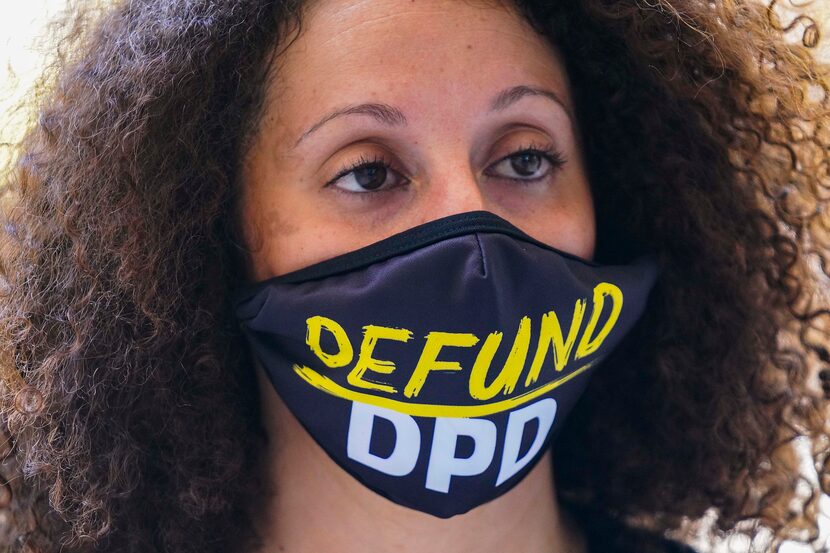 Sara Mokuria of Mothers Against Police Brutality wears a face mask reading ÔDefund DPDÕ...