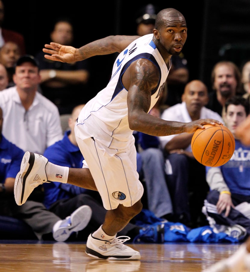 Dallas Mavericks shooting guard Dominique Jones (20) dribbles up the court in a game against...