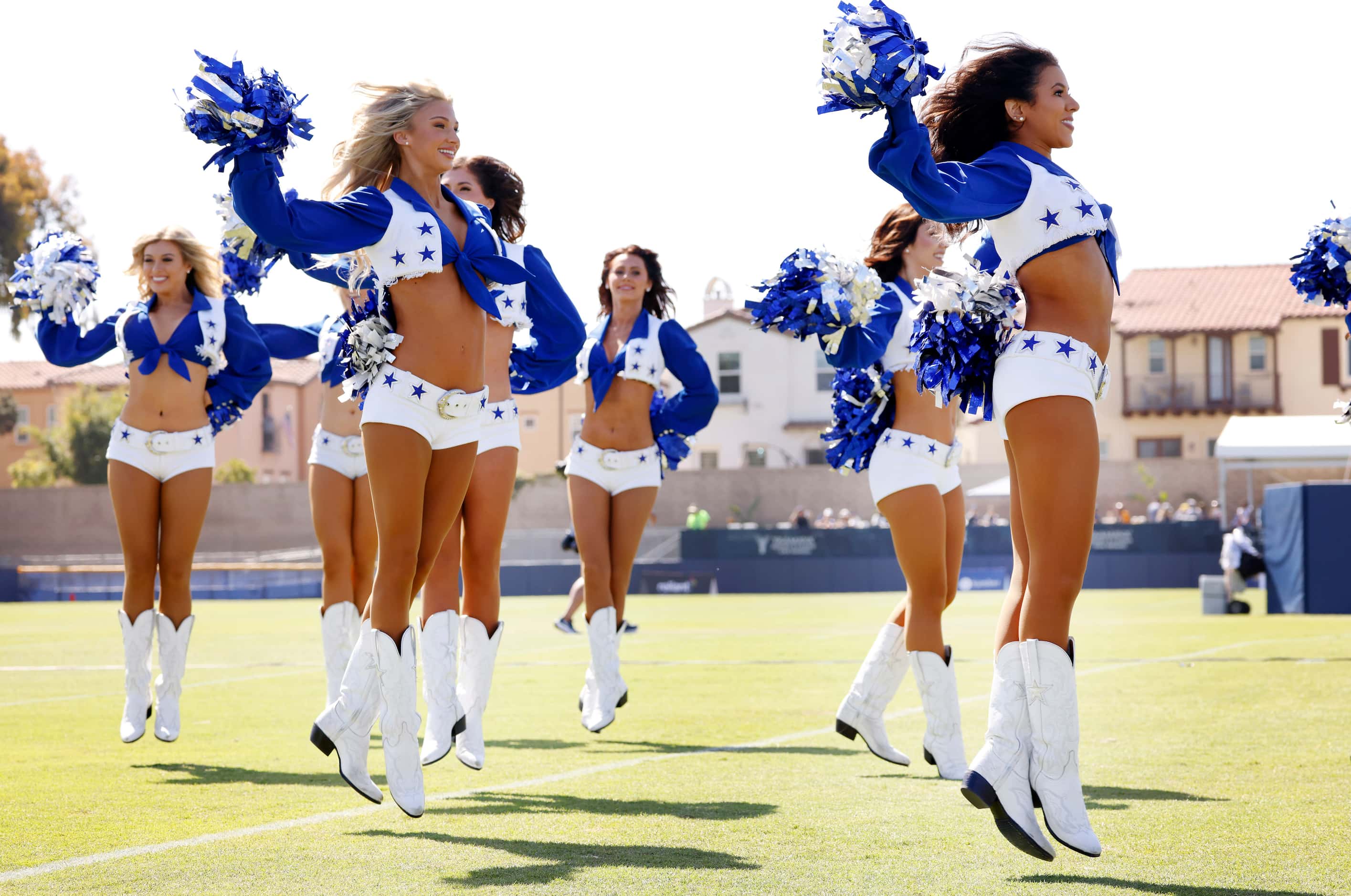 The Dallas Cowboys Cheerleaders perform during the annual training camp opening ceremony and...