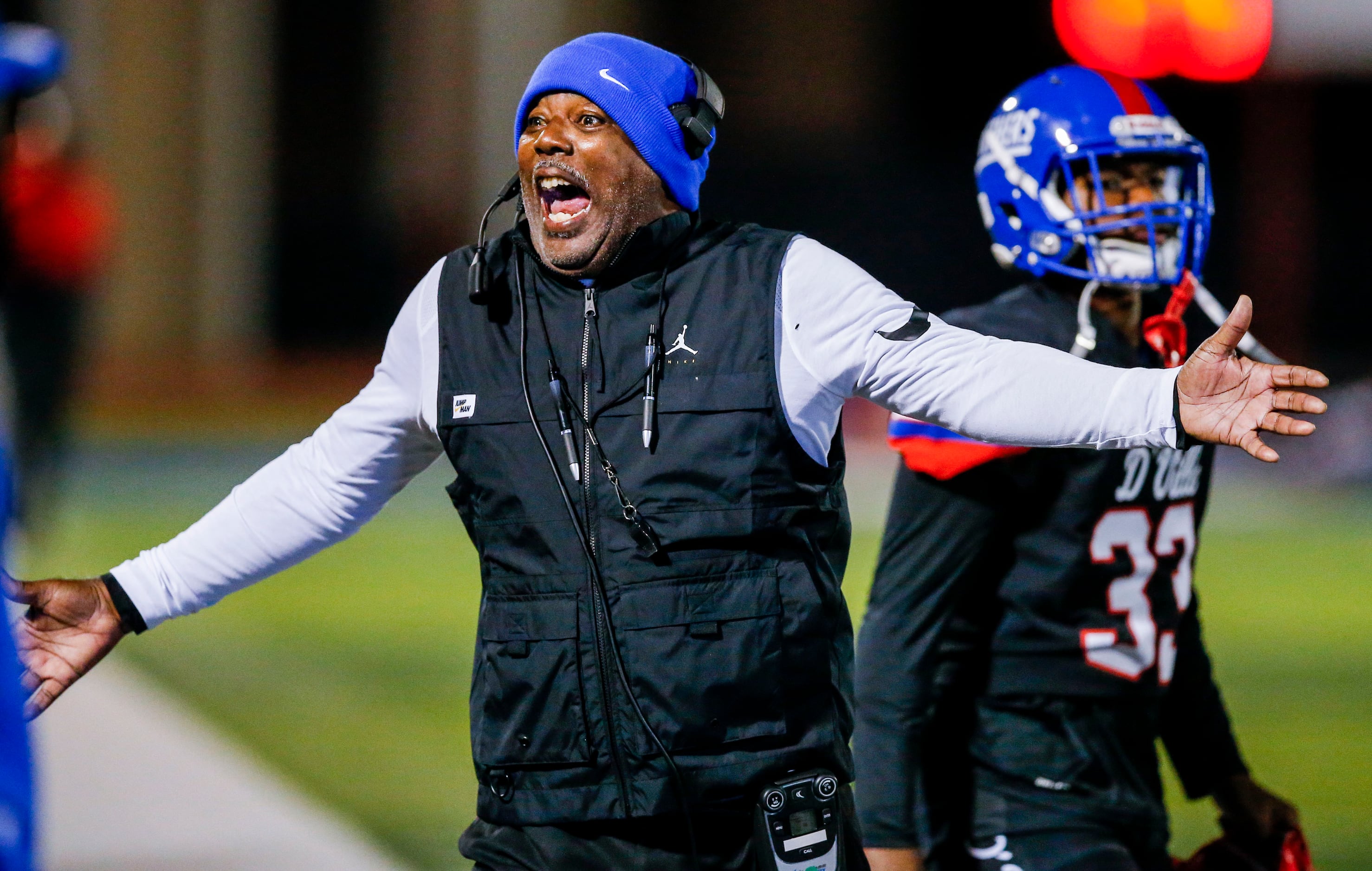 Duncanville head coach Reginald Samples shouts instructions to his team during the first...
