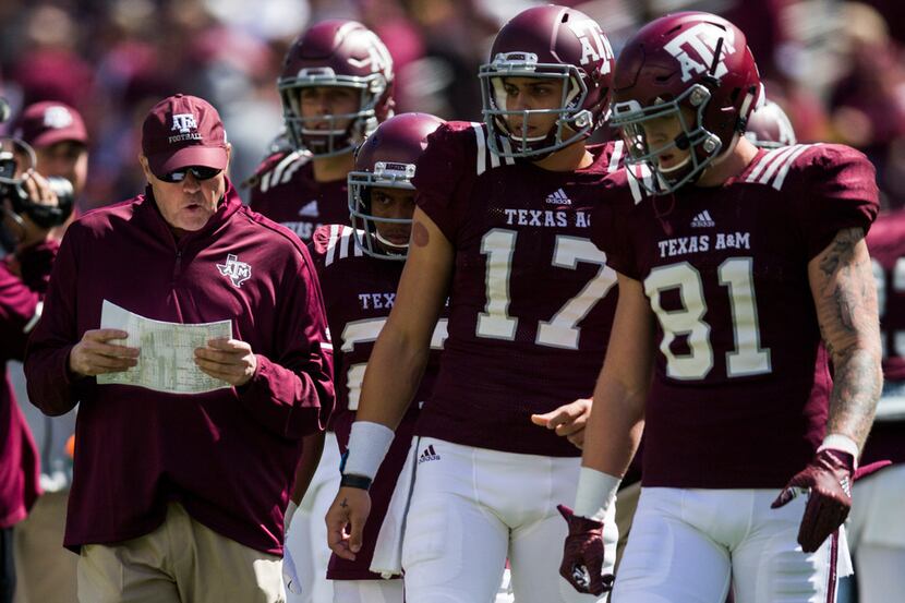 Texas A&M Aggies offensive coordinator Darrell Dickey talks to players during warm-ups...
